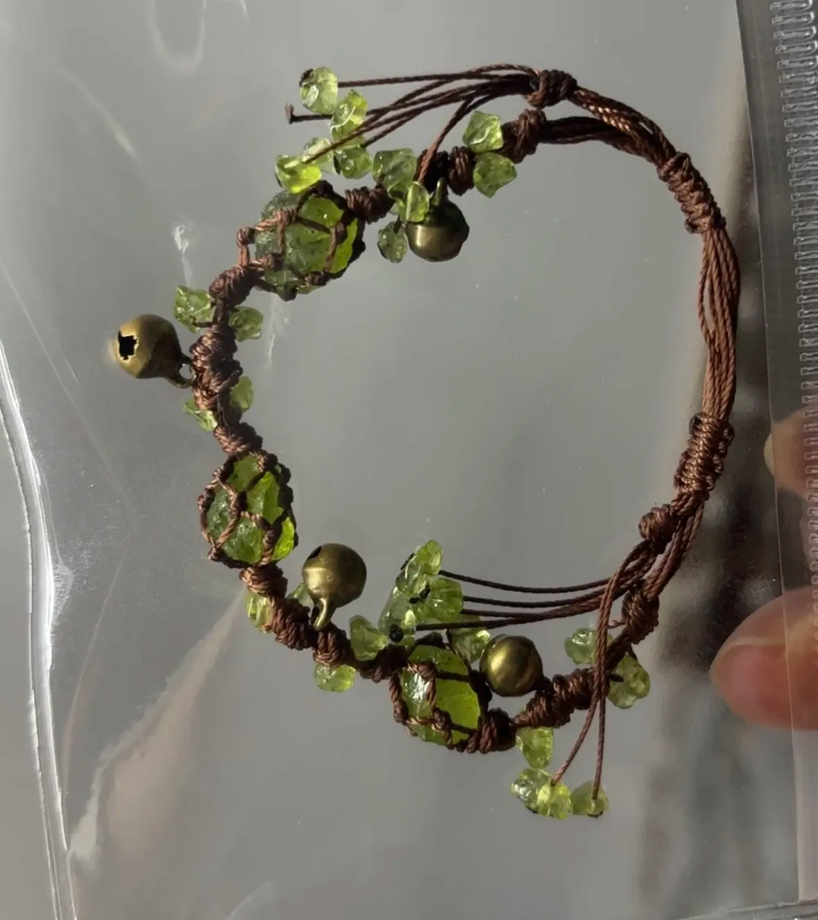 Peridot woven bracelet with bell